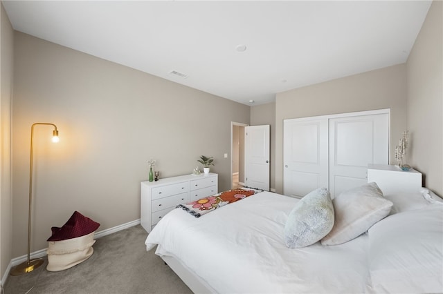 carpeted bedroom featuring a closet