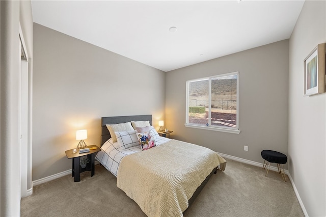 bedroom with light colored carpet