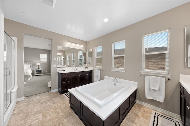 ensuite bathroom featuring a stall shower, vanity, ensuite bath, a bath, and visible vents