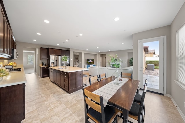 dining room featuring a healthy amount of sunlight and sink