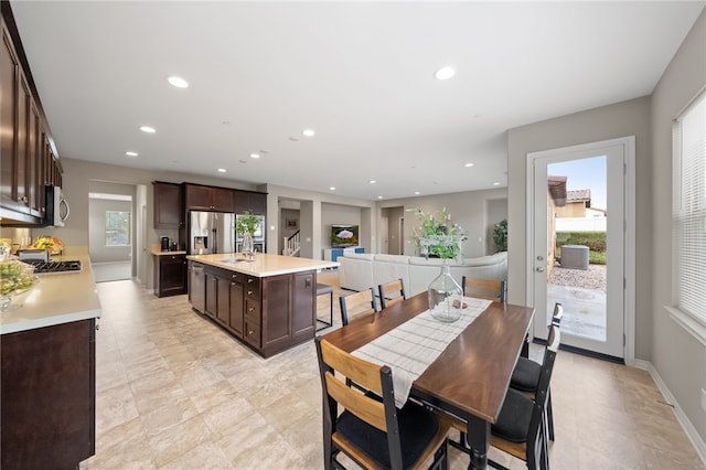 dining room featuring baseboards and recessed lighting