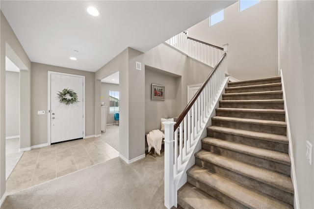 view of carpeted entrance foyer