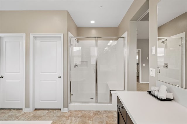 bathroom with vanity and walk in shower