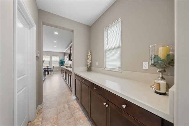 bar with dark brown cabinets