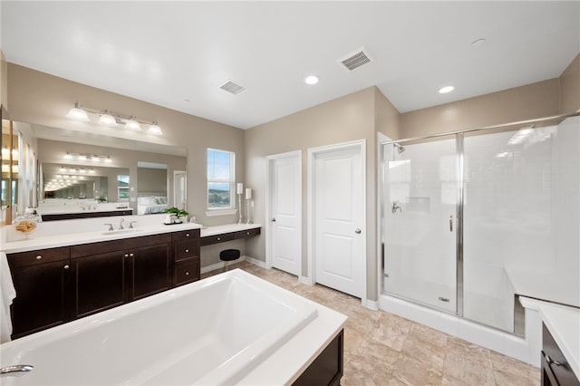 full bathroom with a shower stall, visible vents, vanity, and a bath