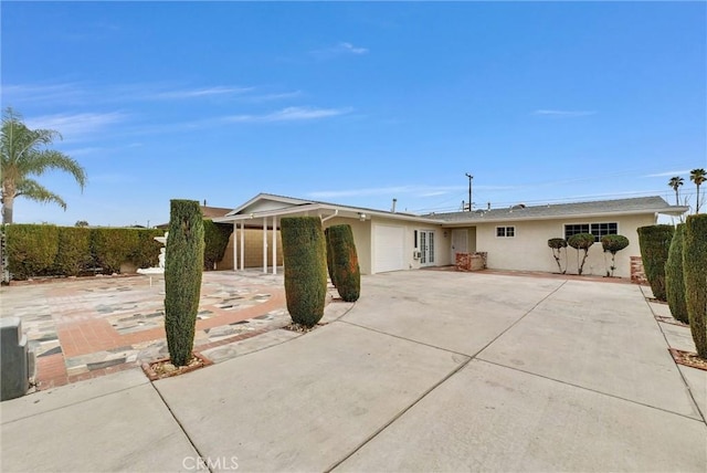 single story home featuring a garage