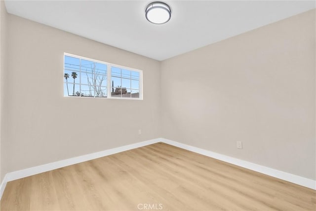 unfurnished room with light hardwood / wood-style floors