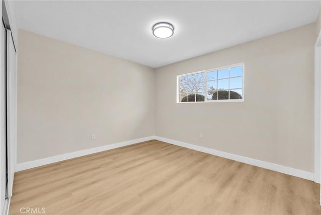 unfurnished room with light hardwood / wood-style floors