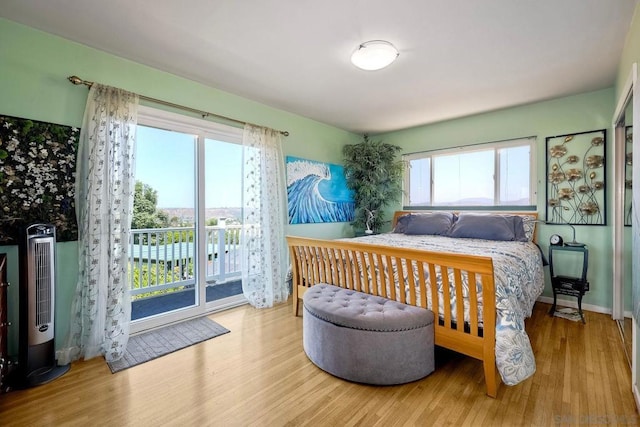 bedroom featuring access to outside and light wood-type flooring