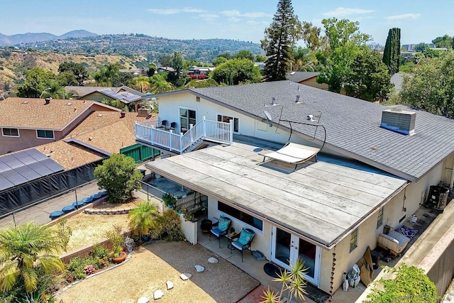 birds eye view of property featuring a mountain view