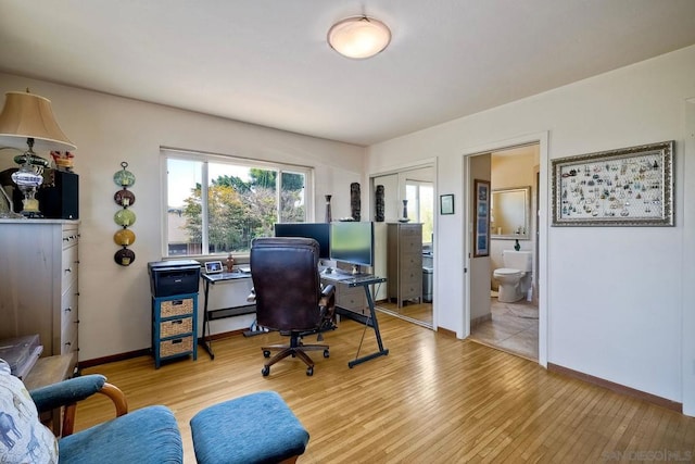 home office featuring light hardwood / wood-style floors