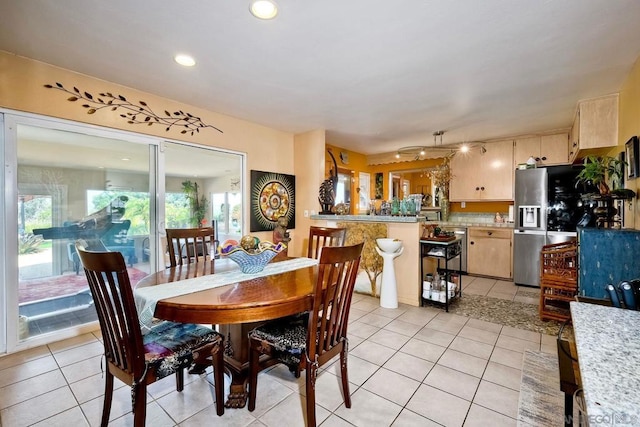 dining room featuring light tile patterned floors