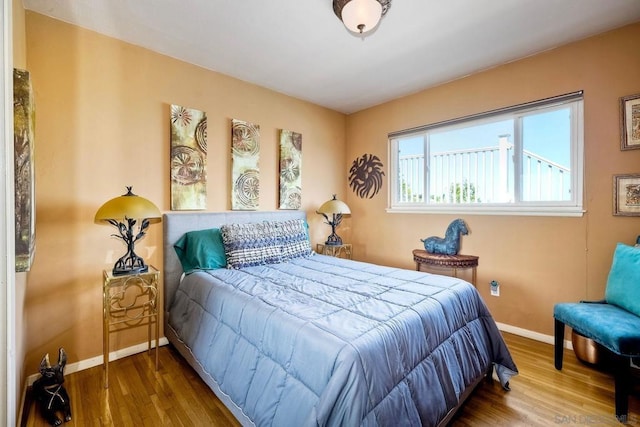 bedroom with wood-type flooring