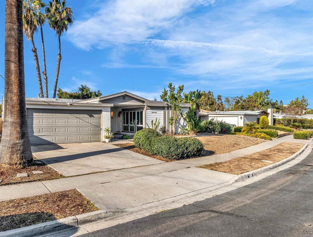 ranch-style home featuring a garage