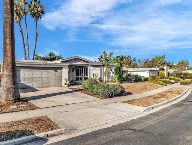 ranch-style home featuring a garage