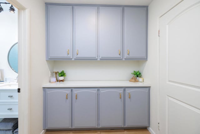 bar with gray cabinetry