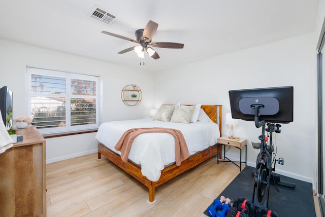 bedroom with light hardwood / wood-style flooring and ceiling fan