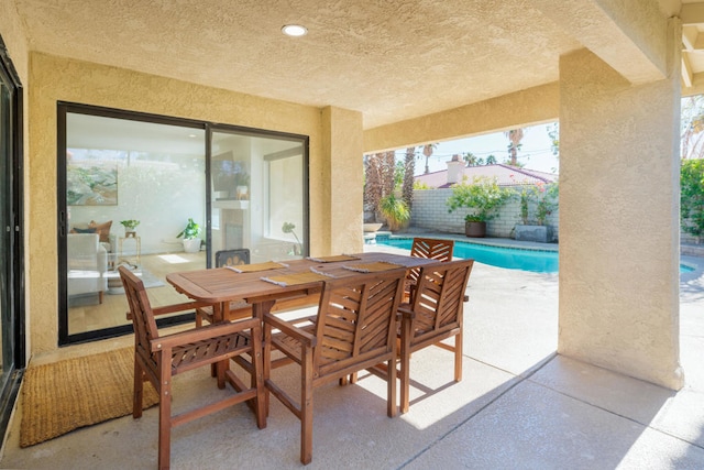 view of patio with a fenced in pool