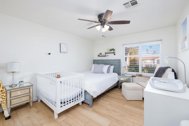 bedroom featuring ceiling fan and light wood-type flooring