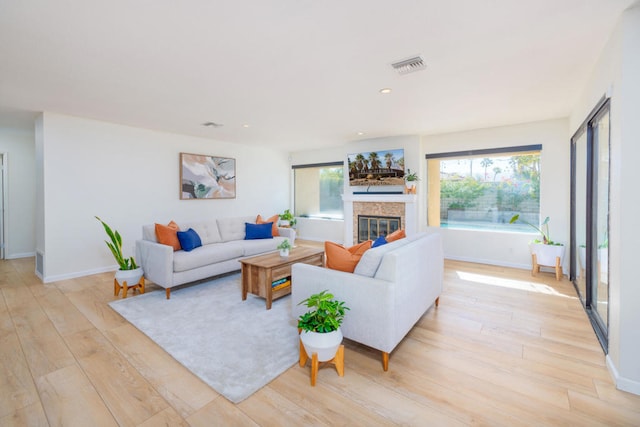 living room with light hardwood / wood-style floors