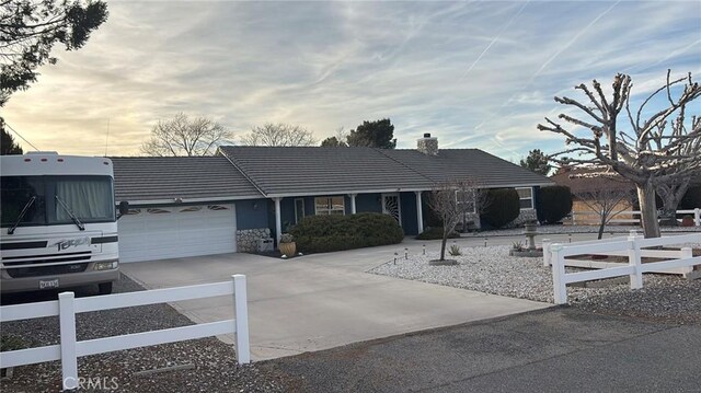 ranch-style house featuring a garage