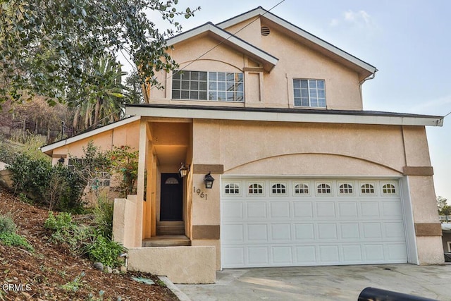 view of front of property with a garage