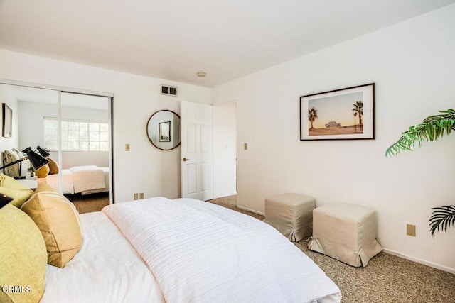 bedroom with carpet floors and a closet