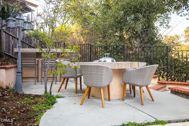 view of patio with an outdoor bar