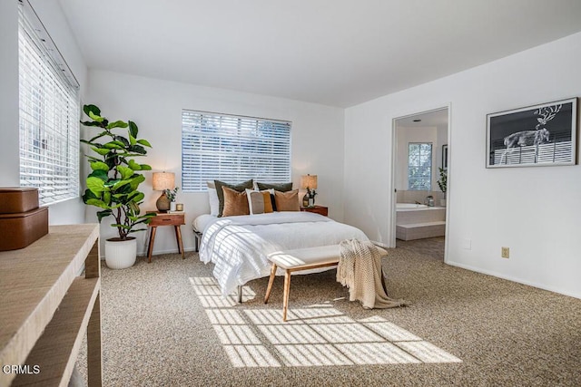 carpeted bedroom featuring ensuite bathroom