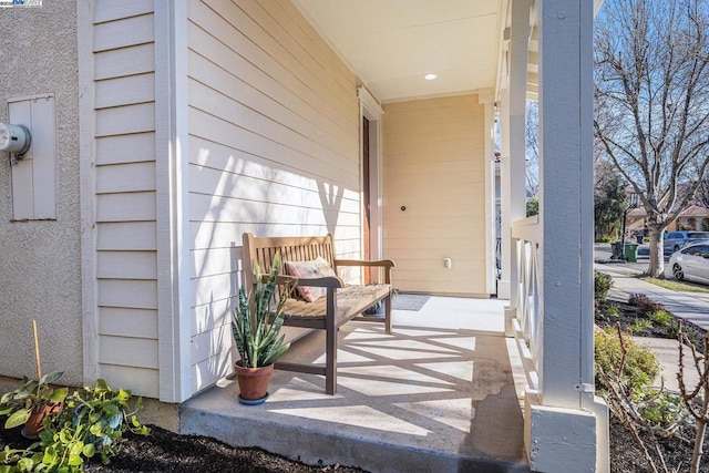 view of exterior entry with covered porch