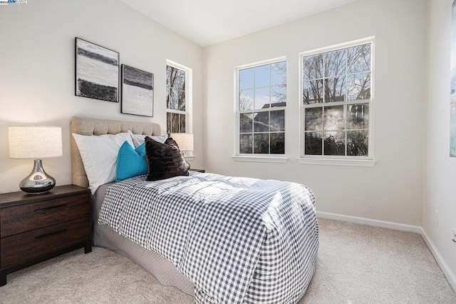 bedroom with light carpet