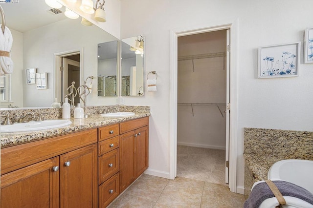 bathroom featuring tile patterned floors and vanity