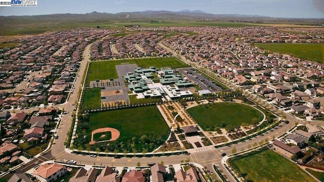 birds eye view of property with a mountain view