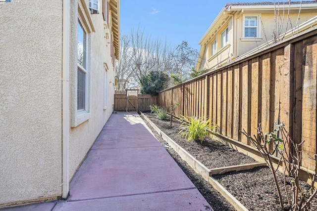 view of side of property featuring a patio