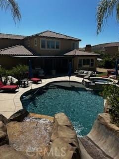 view of pool featuring a patio