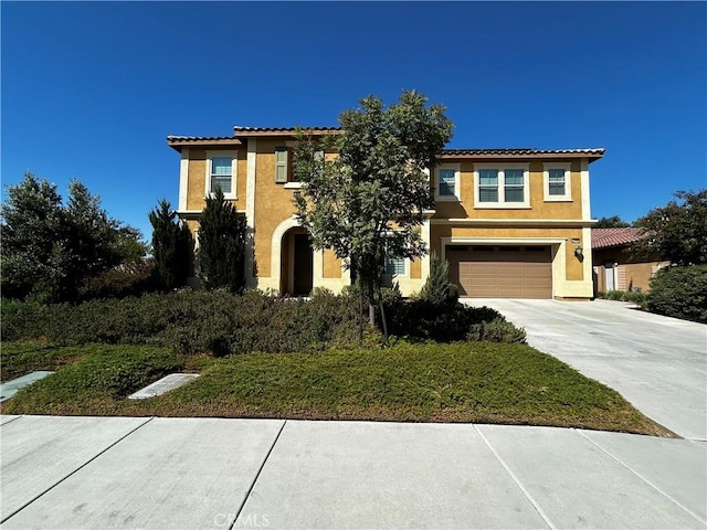 mediterranean / spanish house featuring a garage