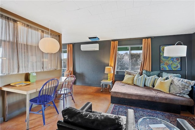 living room with hardwood / wood-style floors and a wall unit AC