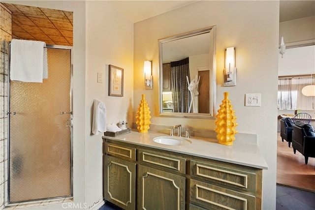 bathroom featuring vanity and an enclosed shower