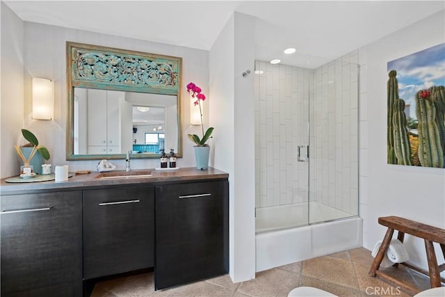 bathroom featuring enclosed tub / shower combo and vanity