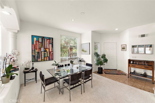 dining area with light tile patterned flooring