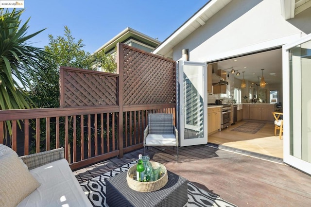 wooden deck with exterior kitchen