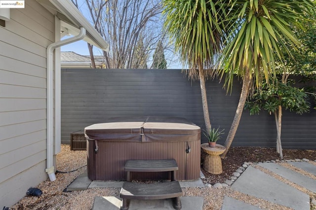 view of patio / terrace with a hot tub