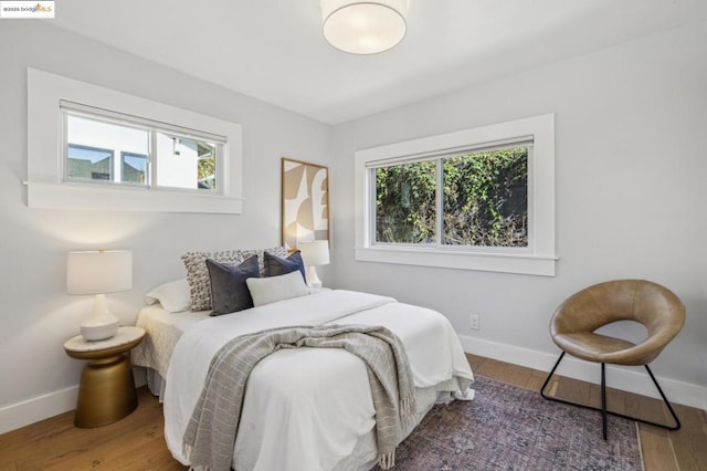 bedroom with wood-type flooring