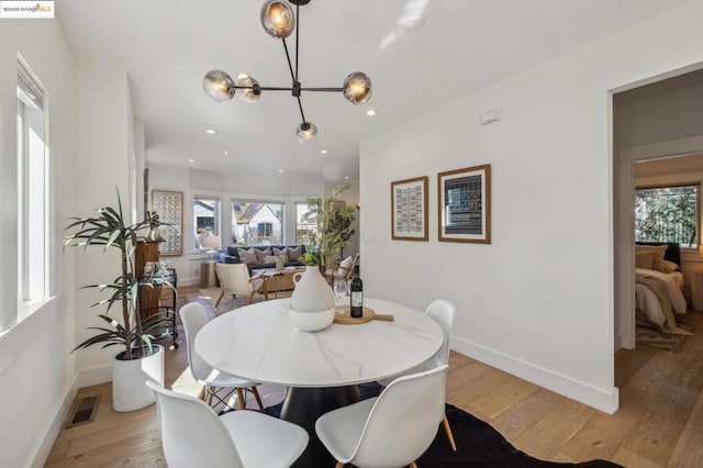 dining room with light hardwood / wood-style floors