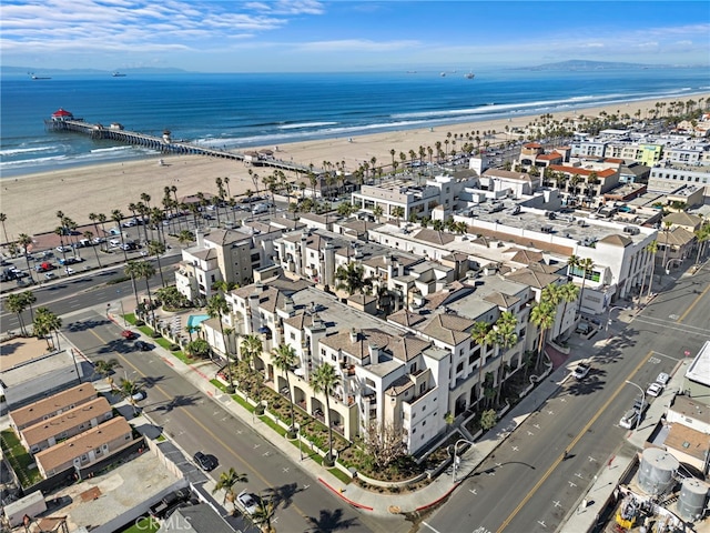 birds eye view of property featuring a water view and a view of the beach