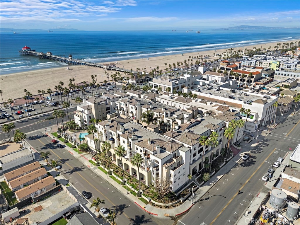 aerial view featuring a view of the beach and a water view