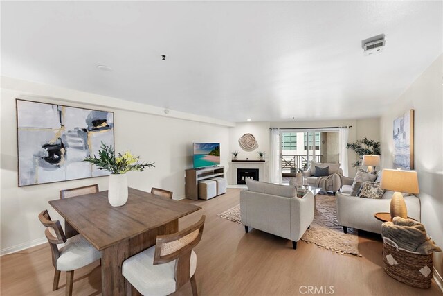 dining area featuring light wood-type flooring