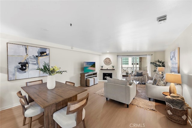 dining room featuring light hardwood / wood-style floors