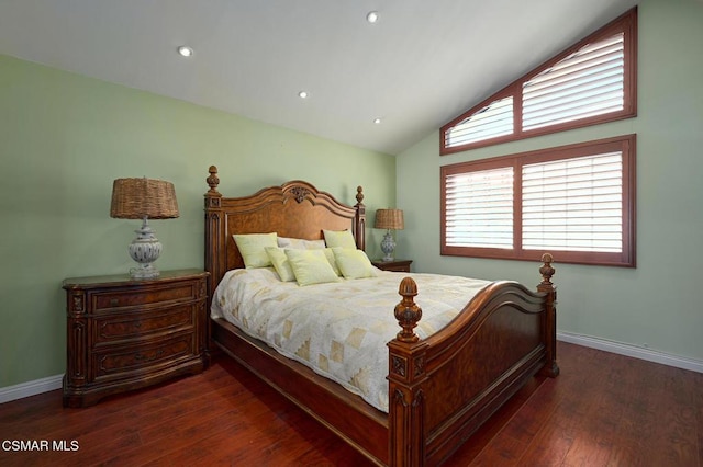 bedroom with lofted ceiling and dark wood-type flooring