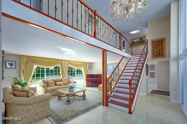 tiled living room with a notable chandelier and a high ceiling